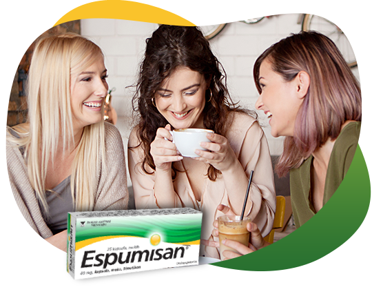 Tri prijateljice piju kafu i zabavljaju se, razmenjuju informacije o flatulenciji i leku Espumisan. Napred se nalazi pakovanje leka Espumisan 40 mg kapsule